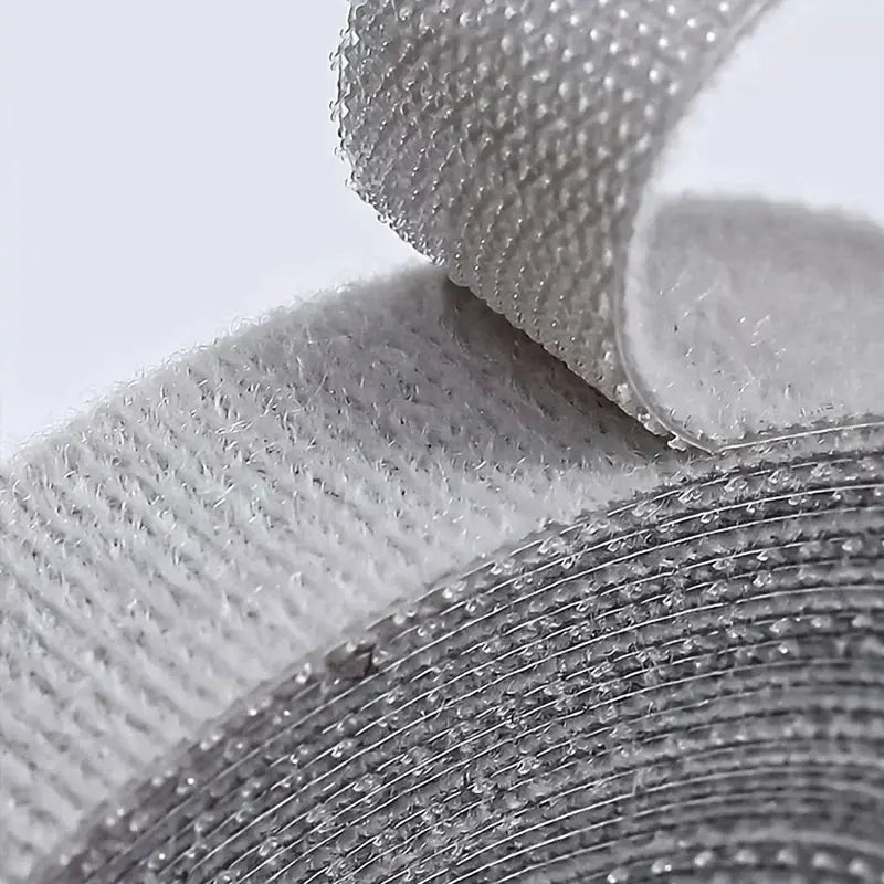 Cable organizer strap by Simples Market in gray Velcro for earphones and cables.