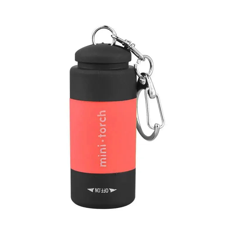 LED micro pocket flashlight keychain; red body with black ends, USB rechargeable, metal carabiner