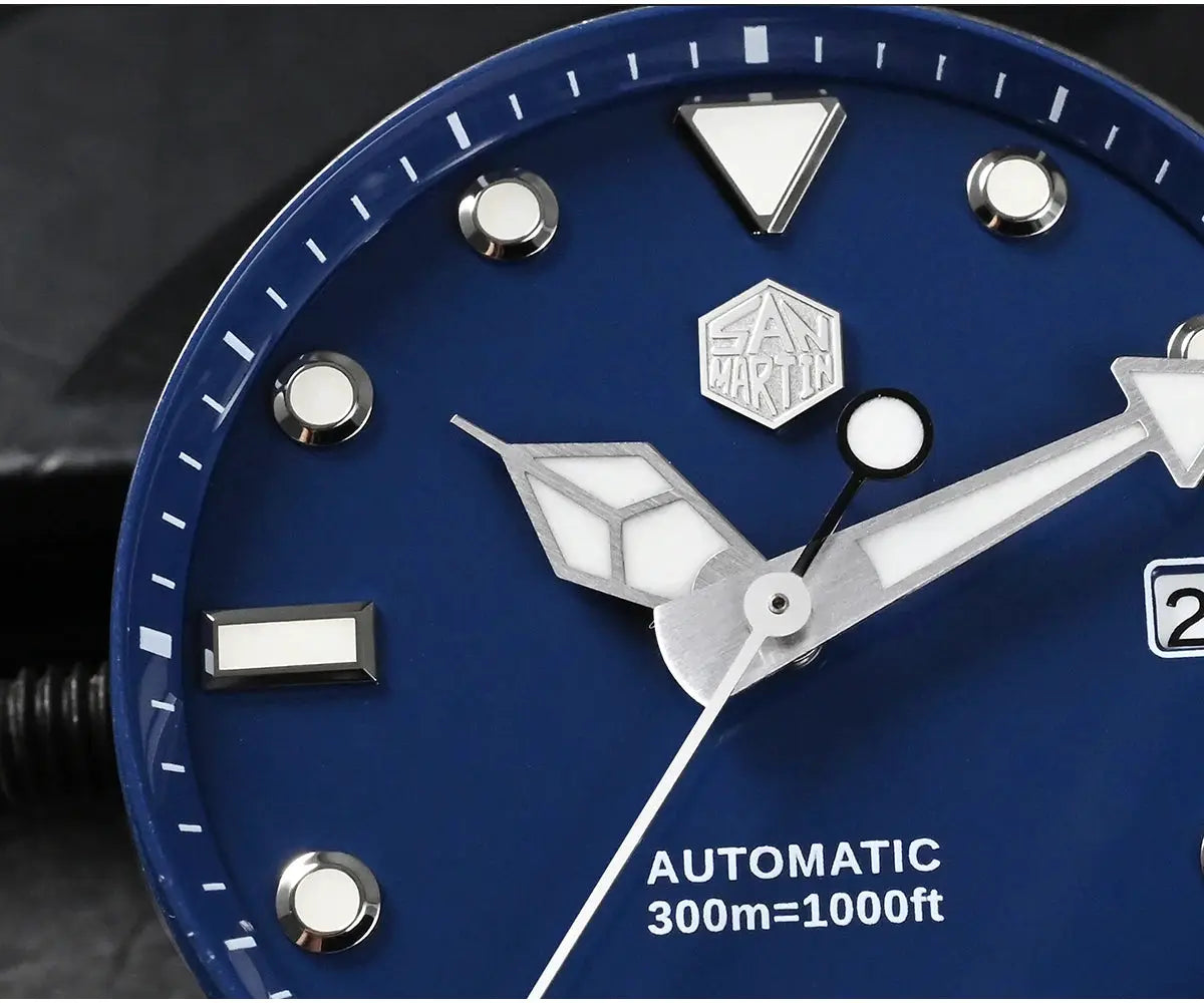 San Martin diver watch dial with blue face, silver hands, white hour markers, date window and 300m water resistance