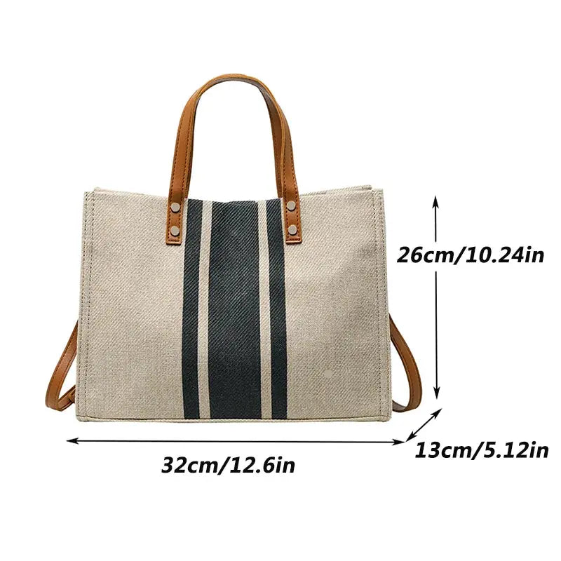 Simples Market canvas stripe tote bag with brown top handles, beige body, central navy stripe, large capacity