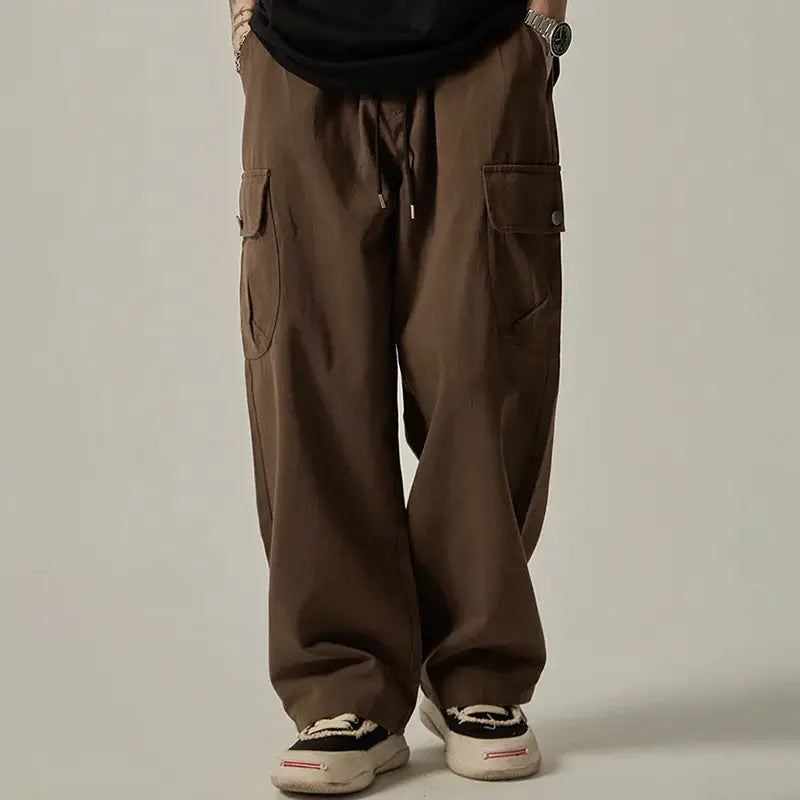 Men's brown cargo sweatpants with drawstring waist, wide straight legs and large side pockets