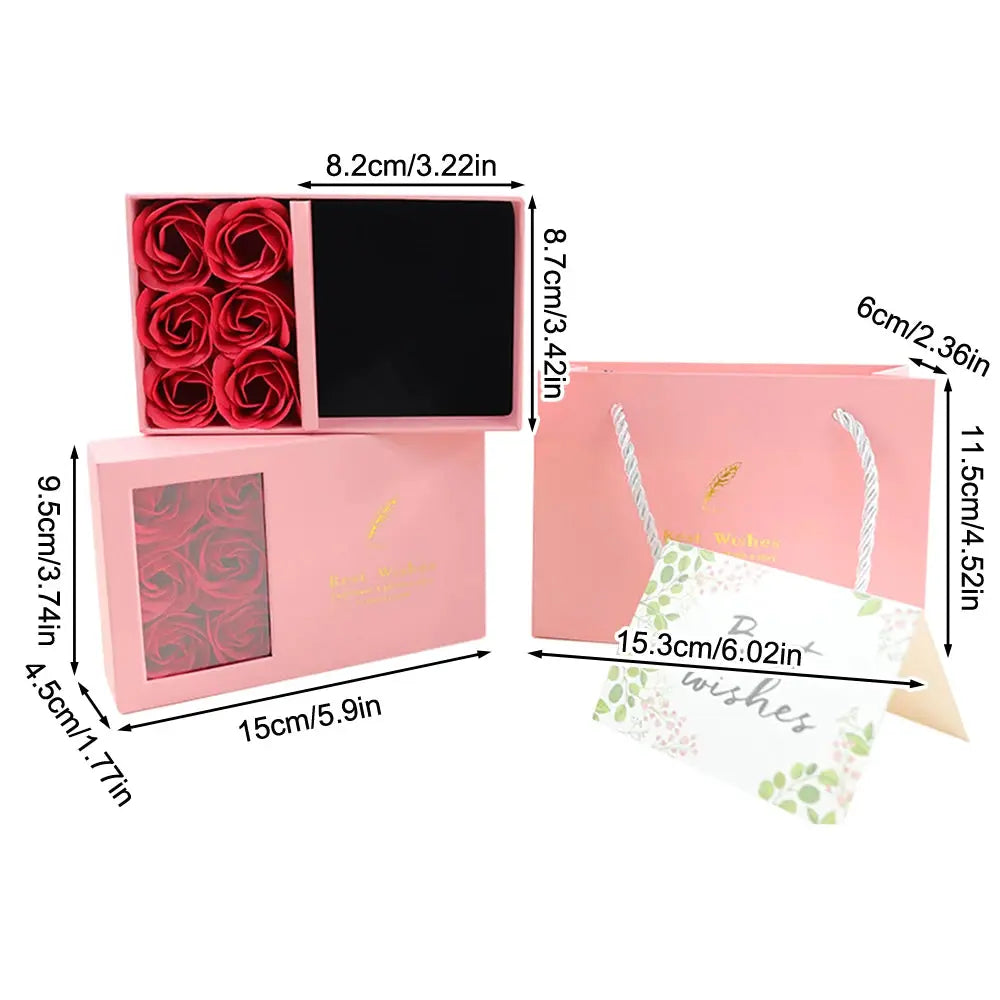 Pink jewelry box with rose display and window; includes six red rose compartments and a matching gift bag
