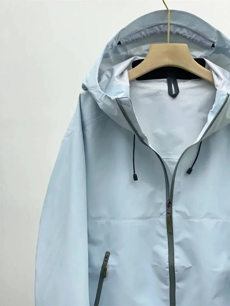 Outdoor windproof soft-shell jacket by Simples Market, light blue with hood