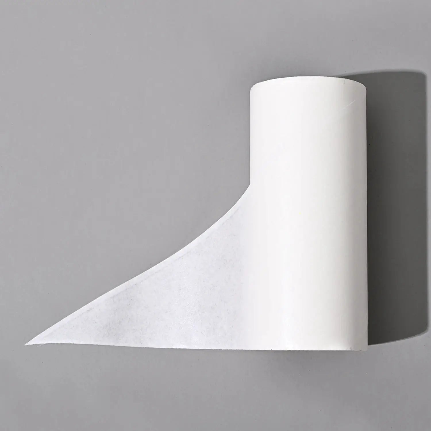 Lint roller with replaceable roll; white compact cleaning tool for pet hair and dust