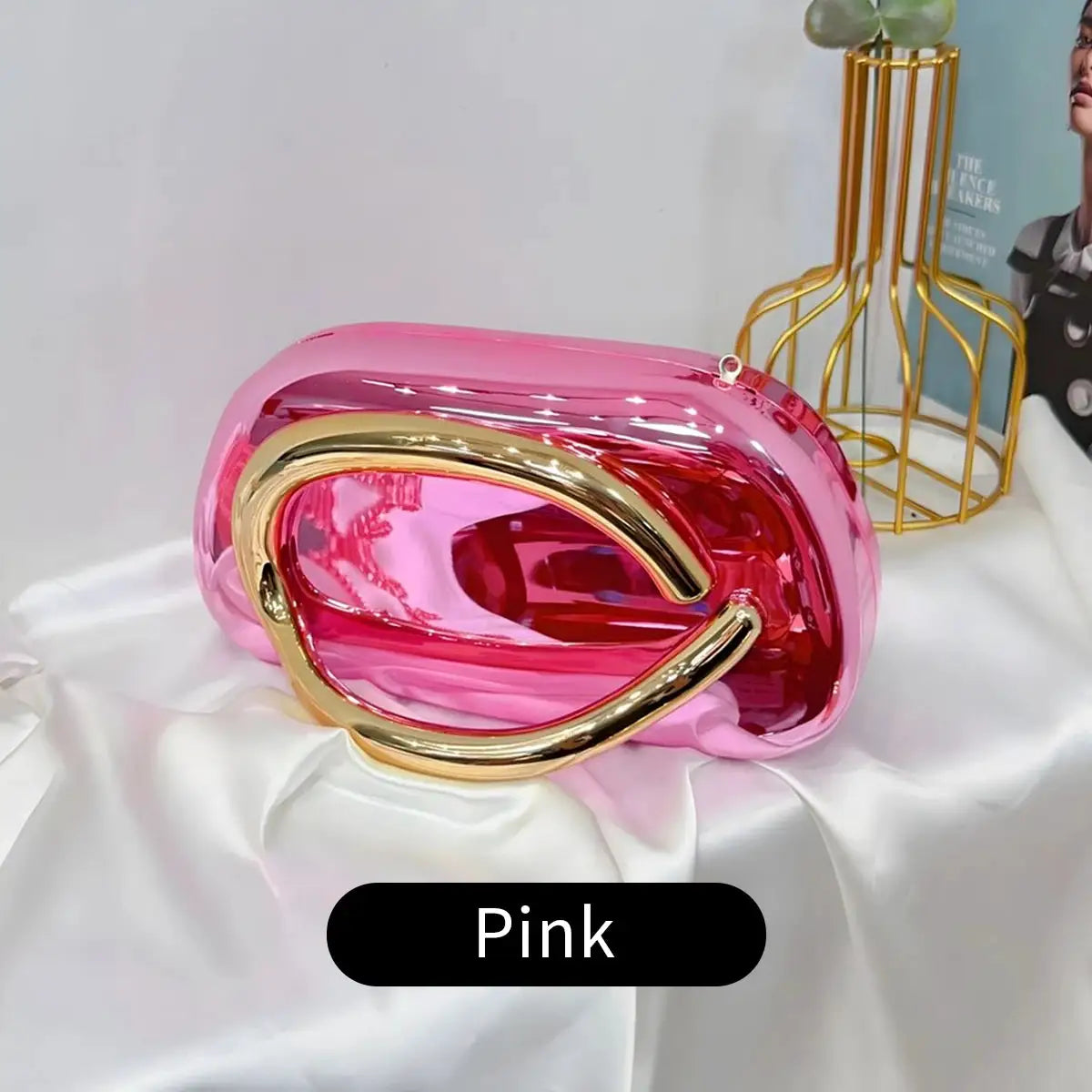 Pink acrylic box-shaped crossbody bag with a gold-tone curved handle, evening party clutch
