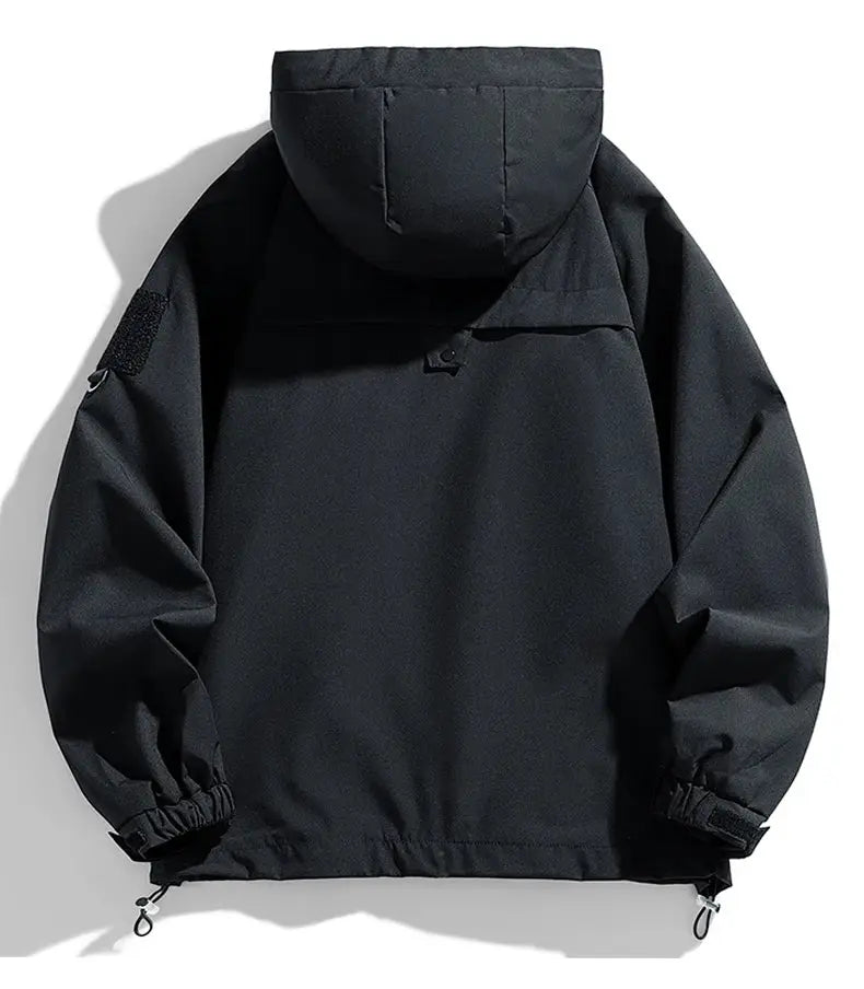 Windbreaker jacket for men, black hooded softshell with loose fit, drawstring hem and elastic cuffs.