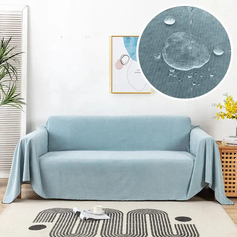 Simples Market waterproof sofa towel in solid blue over a living room sofa with a circular close-up of water droplets.