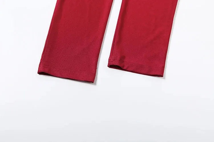 Sisterlinda red jumpsuit pant legs pair laid flat on a white background