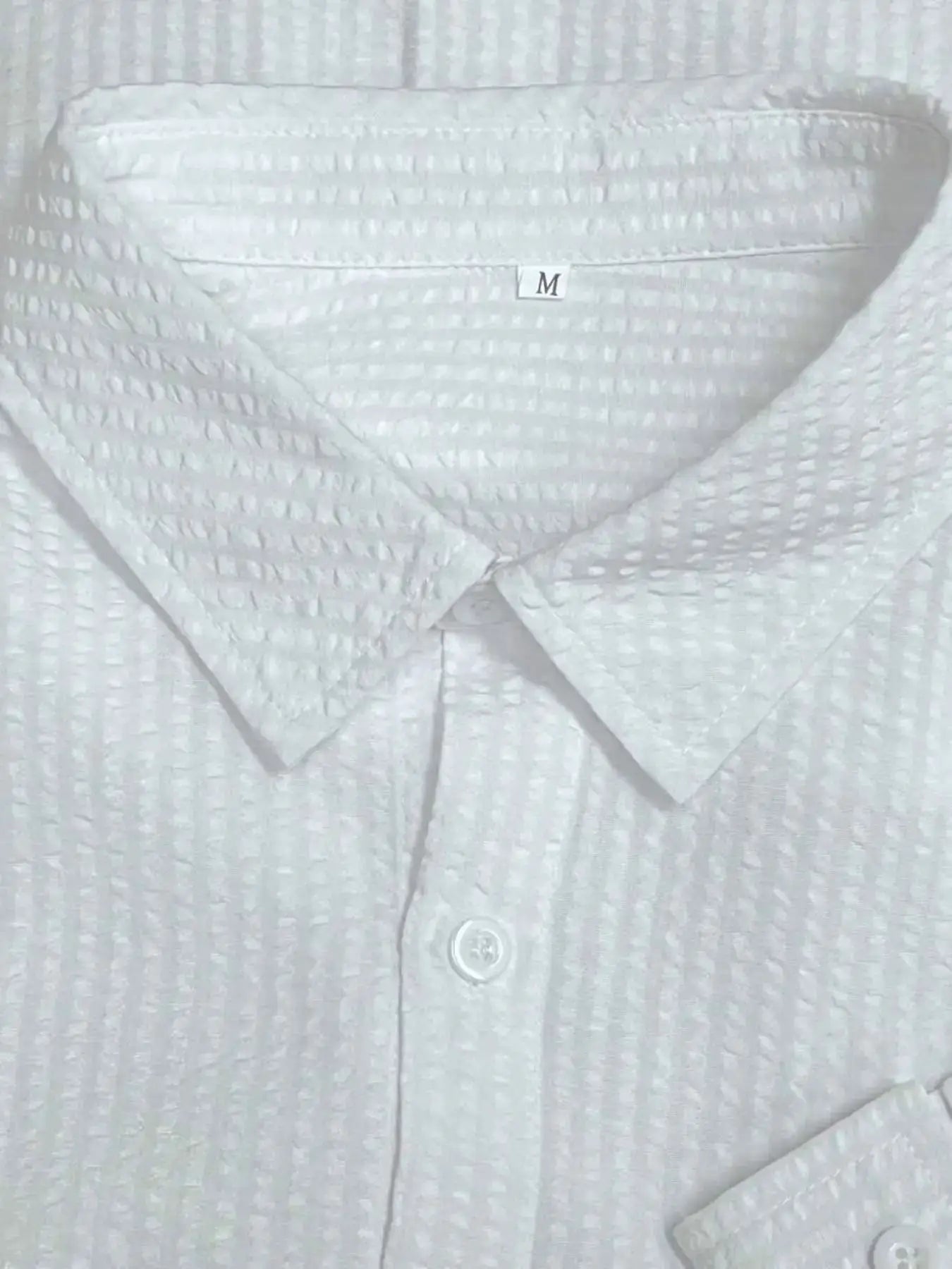 Men's white textured long-sleeve shirt with collar and button placket, size M