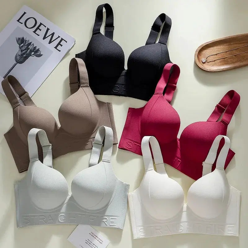 Set of six women's bras in black, taupe, beige, pink, magenta and white; assorted colors.