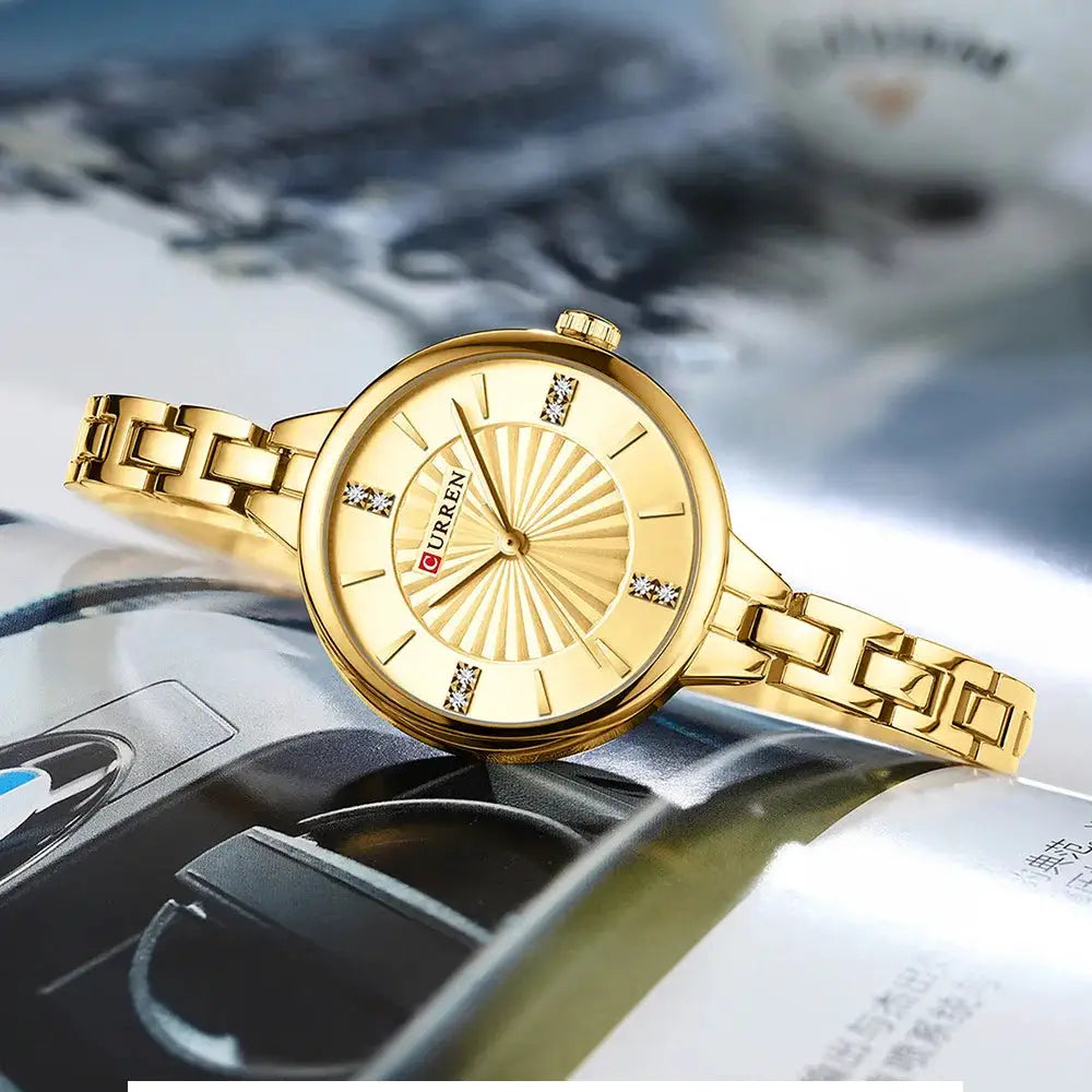Curren 9097 gold-tone women's quartz watch with stainless steel bracelet and crystal markers