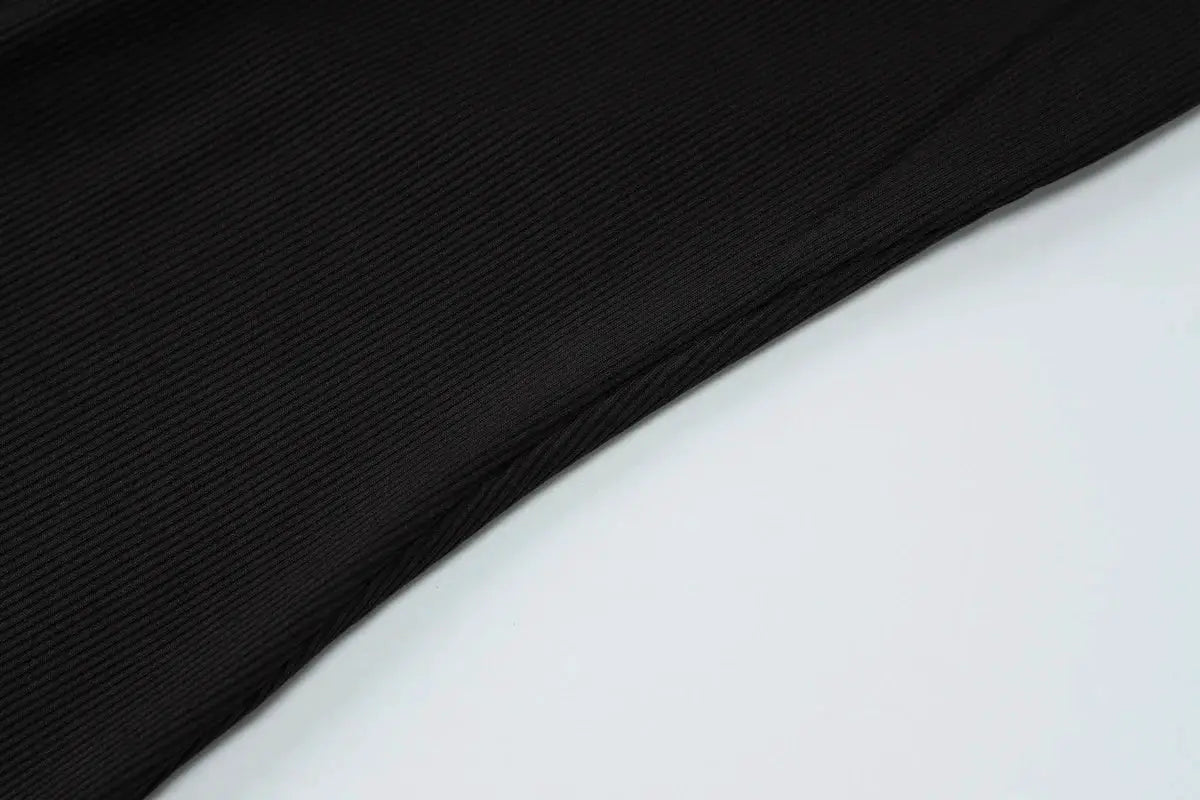 Black ribbed fabric swatch for jumpsuit with diagonal fold texture