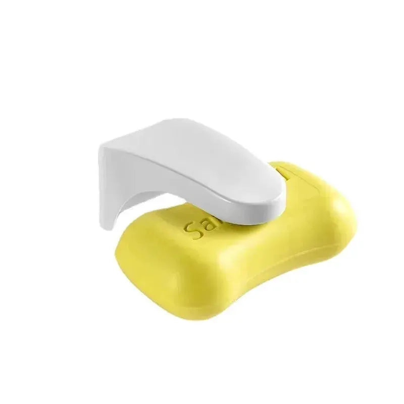 Magnetic soap holder in yellow with a white arm, punch-free bathroom accessory.
