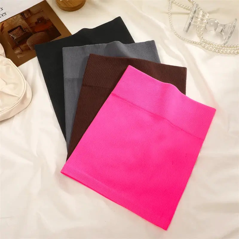 Five ribbed high-waist mini skirts in assorted colors (pink, brown, gray, black, charcoal)