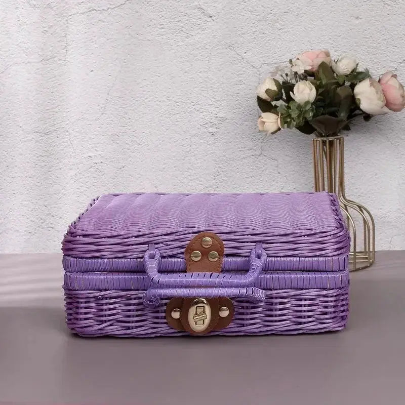 Purple woven rattan-style storage box with brown latch and handle, retro decorative suitcase.