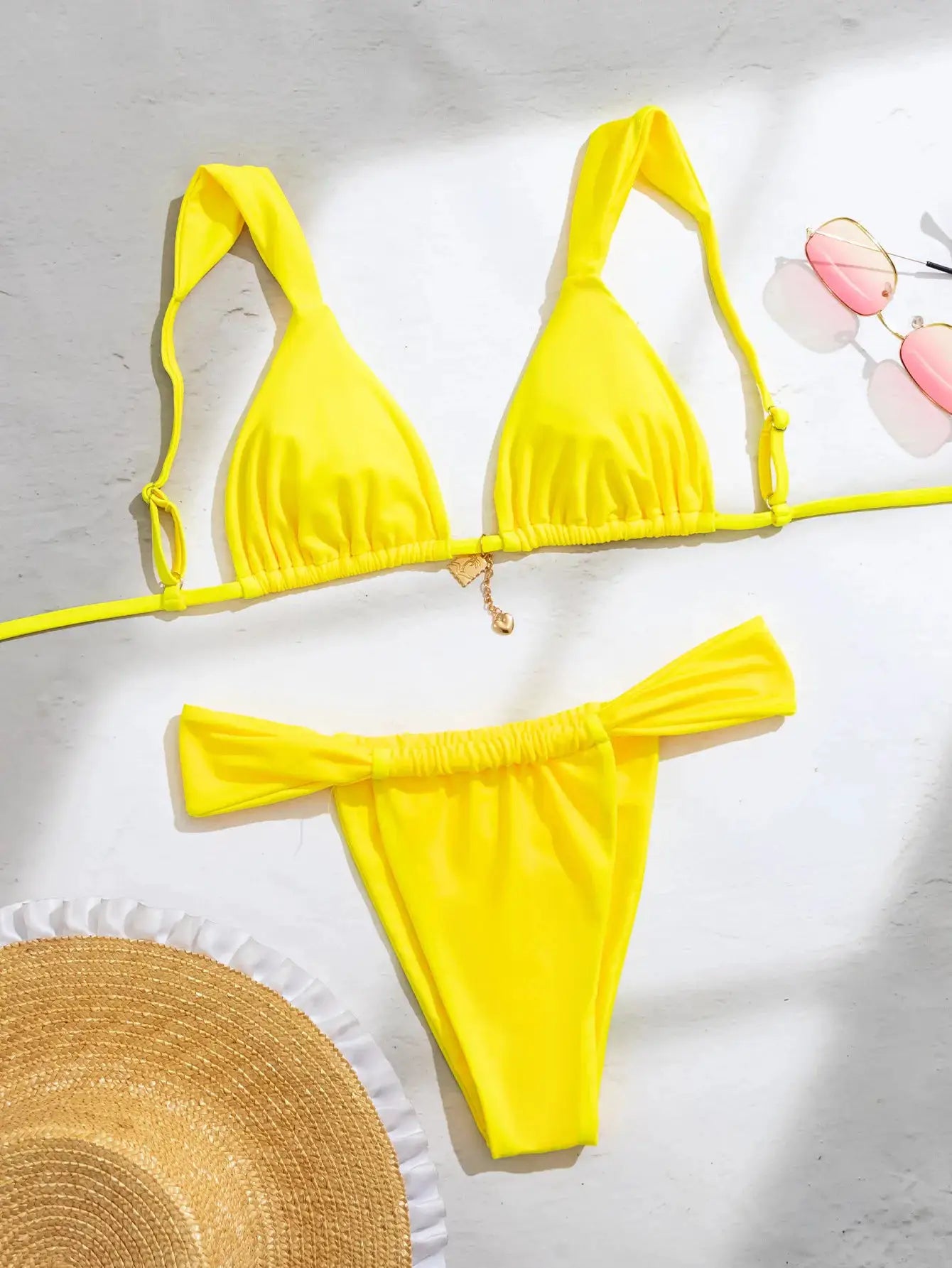 Simples Market bright yellow triangle bikini set with push-up top and Brazilian bottoms.