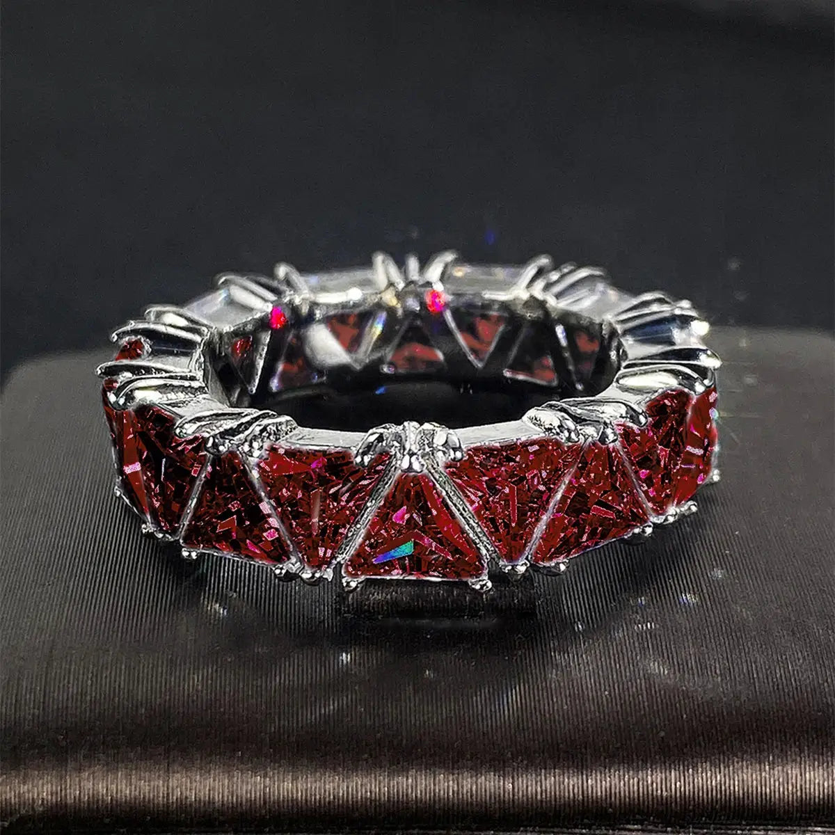 Huitan triangle-design cubic zirconia promise ring for women, red stones on a silver-tone brass band