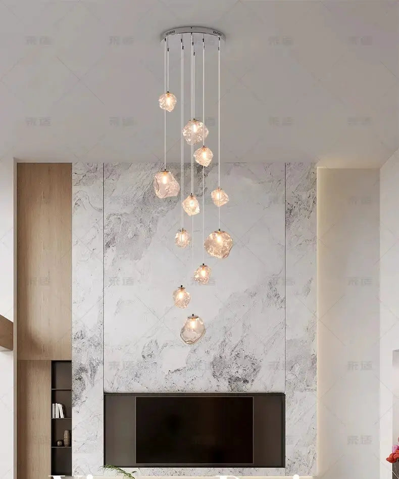 Modern LED pendant light chandelier with crystal glass spheres, multi-drop hanging in a living room