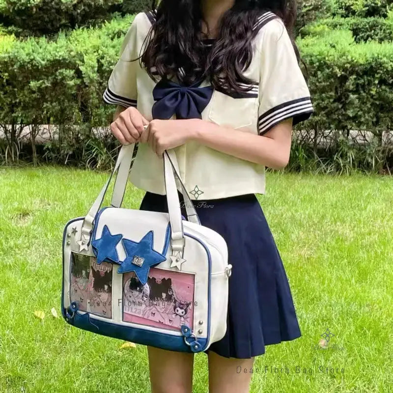 Ita bag white with blue star patches, transparent front pocket with pink insert, sailor-inspired crossbody purse