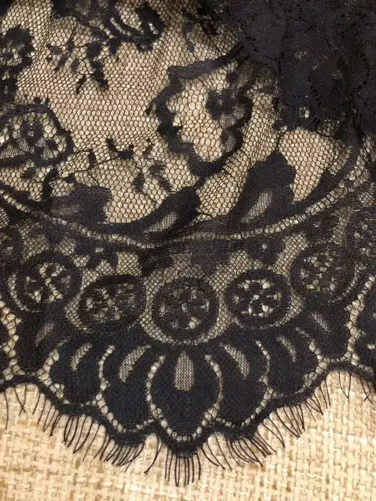 Black lace half slip underskirt with floral pattern and scalloped hem