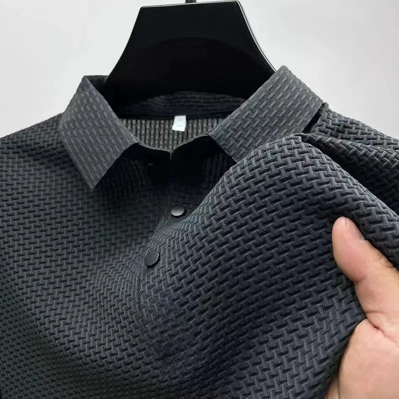 Men's charcoal gray polo shirt with a textured weave, short sleeves and button placket.