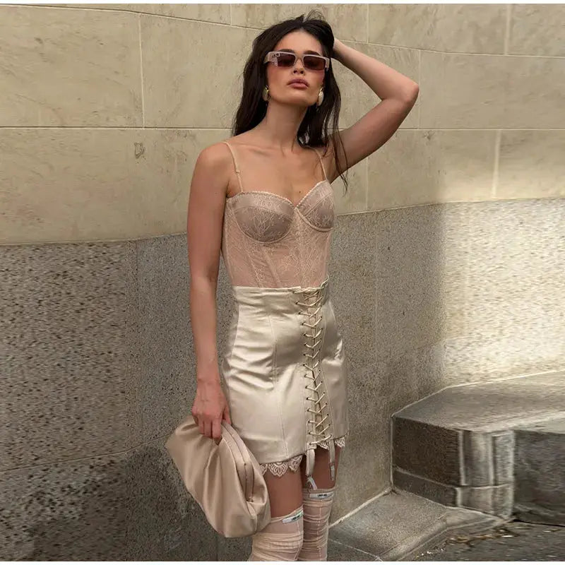 Beige satin skirt with front lace-up detail and lace trim