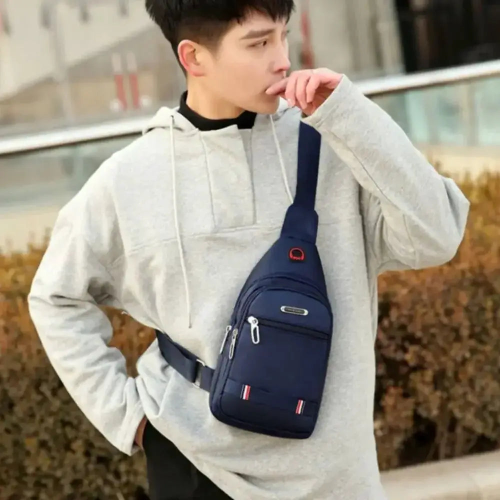 Men's crossbody bag by Simples Market; navy Oxford cloth with three zip pockets