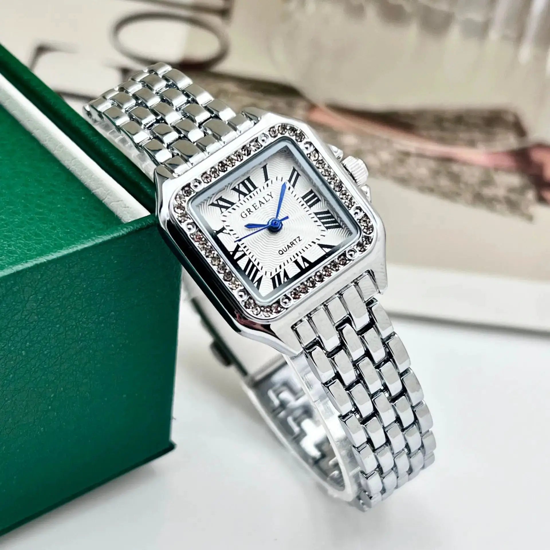 Women's silver stainless steel quartz wristwatch with crystal-studded bezel by GRAELY