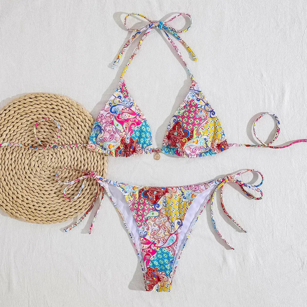 Simples Market two-piece bikini set with multicolor paisley print, triangle top with adjustable ties and tie-side bottoms