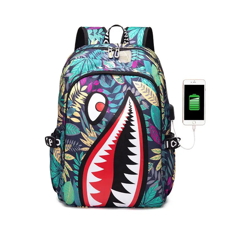 Backpack with cartoon shark mouth print on a bright tropical leaf pattern for elementary students