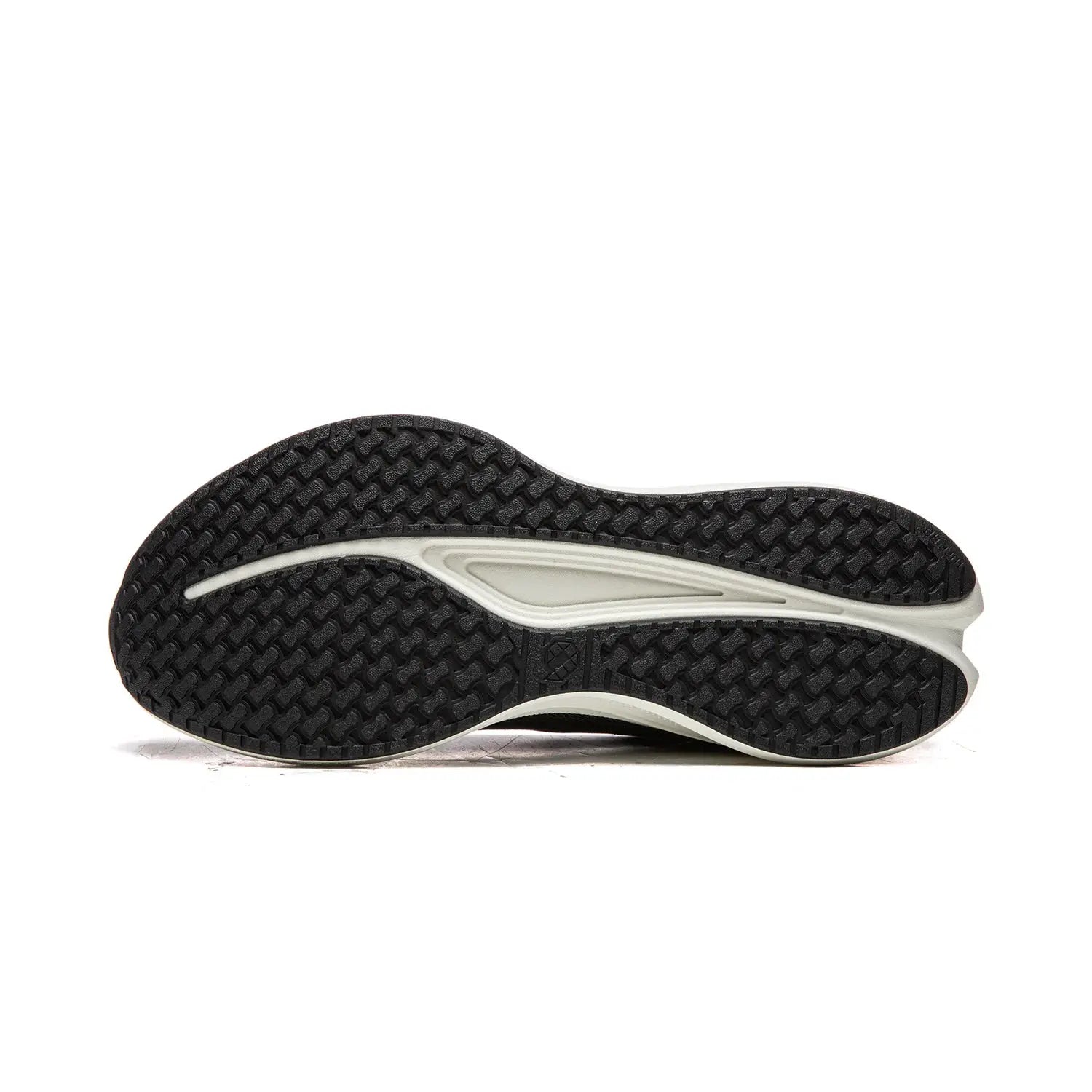 Running shoe outsole with black textured tread and white midsole insert