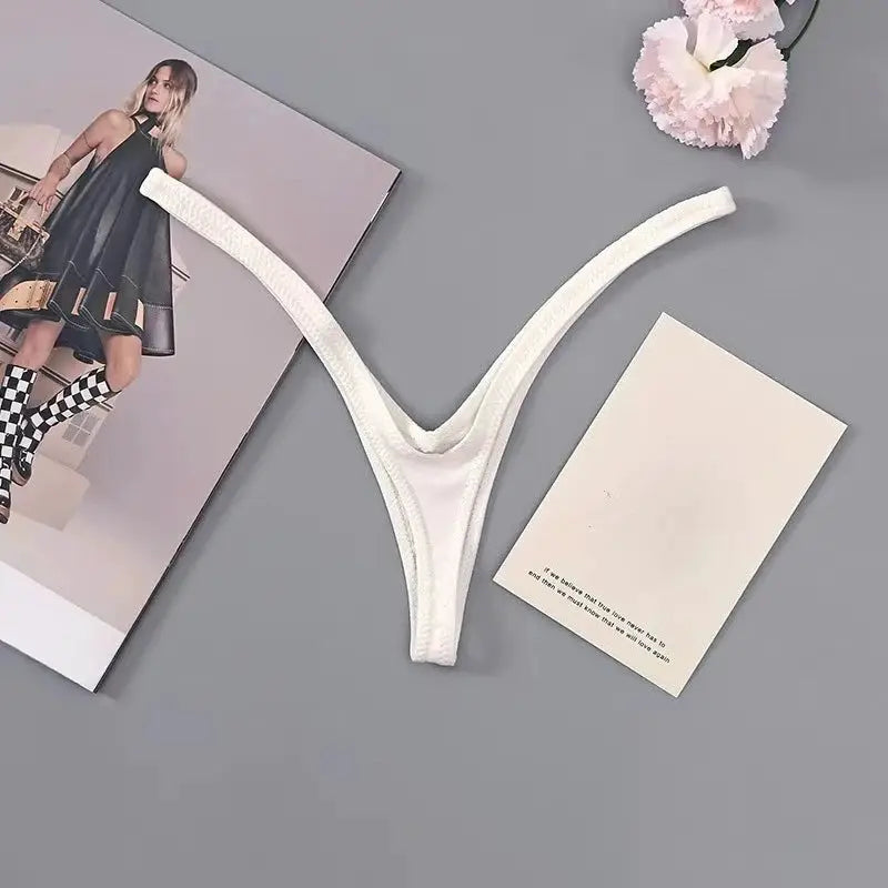 Women’s white thong underwear, deep V Brazilian low-rise with thin straps, breathable fabric from Simples Market.