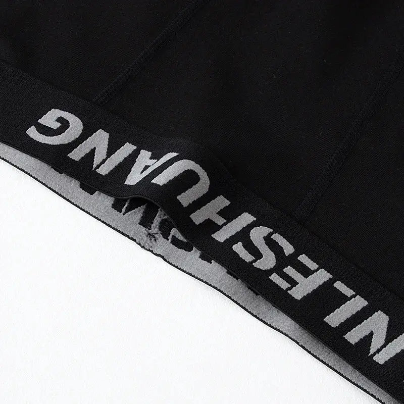 Men's black long sports boxer shorts with Simples Market branded elastic waistband