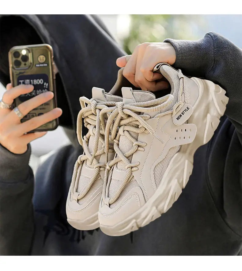Pair of men's beige chunky sneakers with thick soles for casual outdoor running