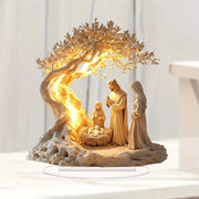 Nativity scene ivory-toned statues with Mary, Joseph and baby Jesus beside a glowing golden tree on a rocky base