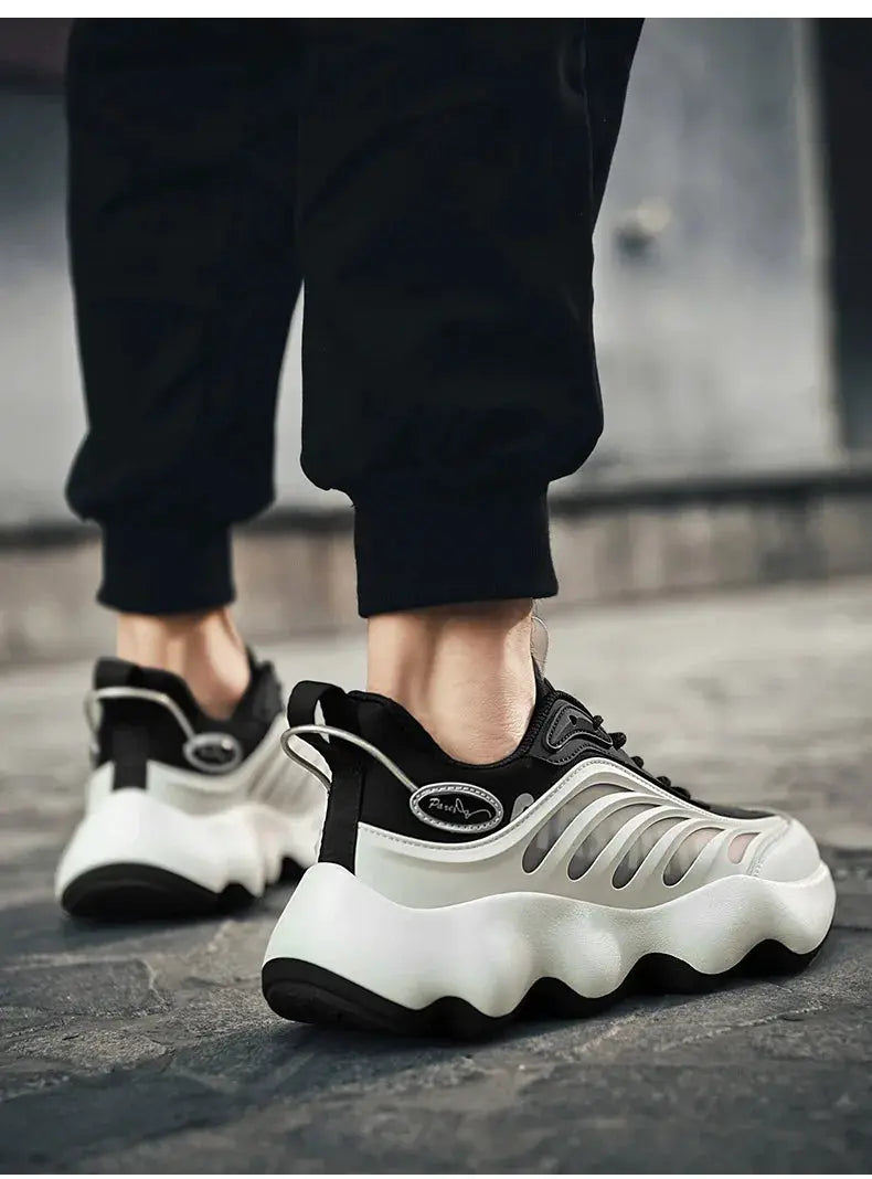 Men's sneakers with black upper and white chunky wavy sole, breathable side cutouts