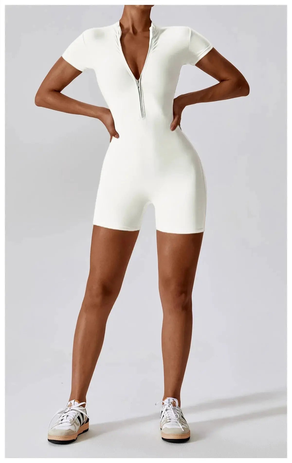 Women's white zipper short-sleeve yoga jumpsuit from Simples Market; quick-dry breathable fabric.