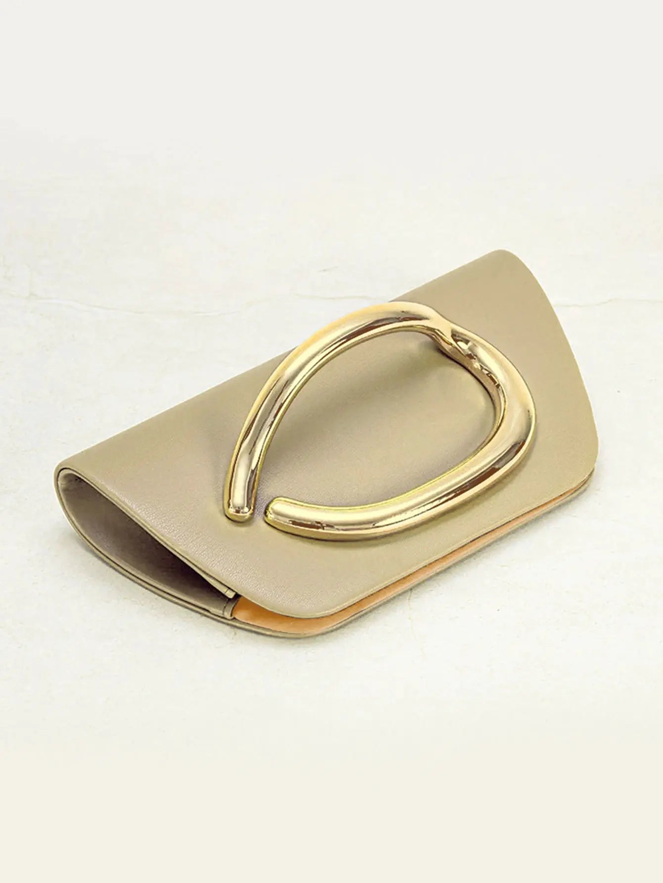 Beige box clutch with large gold-tone buckle, evening bag