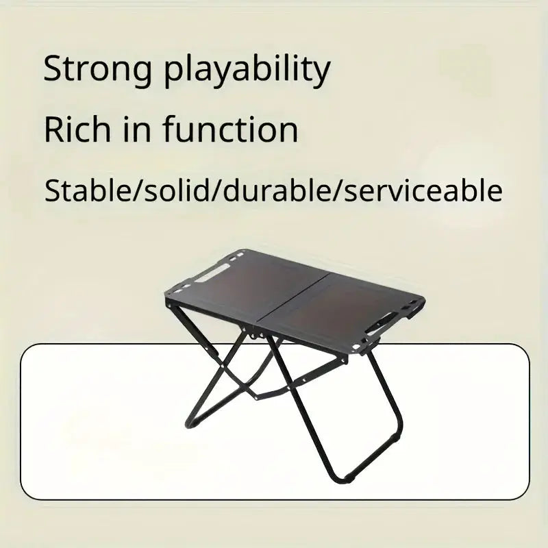 Portable folding camping table with a black steel frame, compact foldable design.