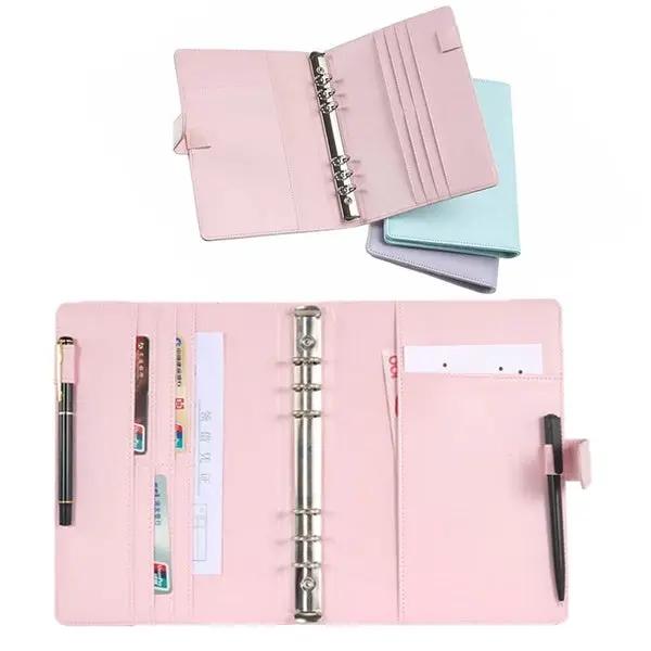 Pink leather refillable notebook file folder with six-ring binder and pen loop; pastel pink, blue and lavender set.