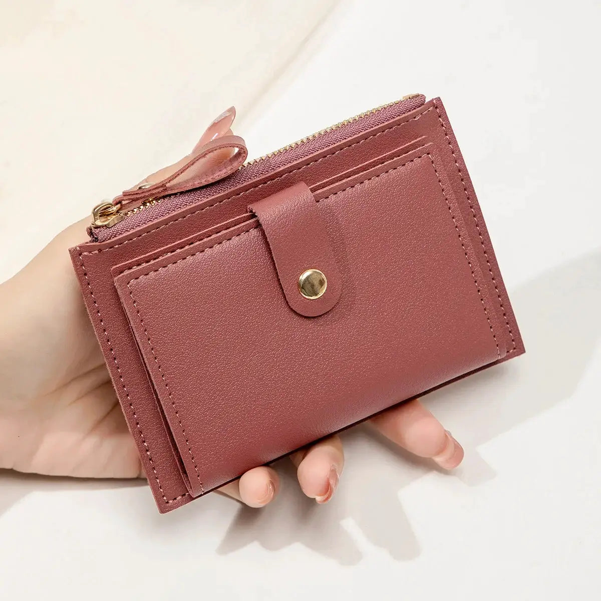 Minimalist women's short card wallet in rose-pink PU leather, ultra-thin zero wallet with zipper and snap strap