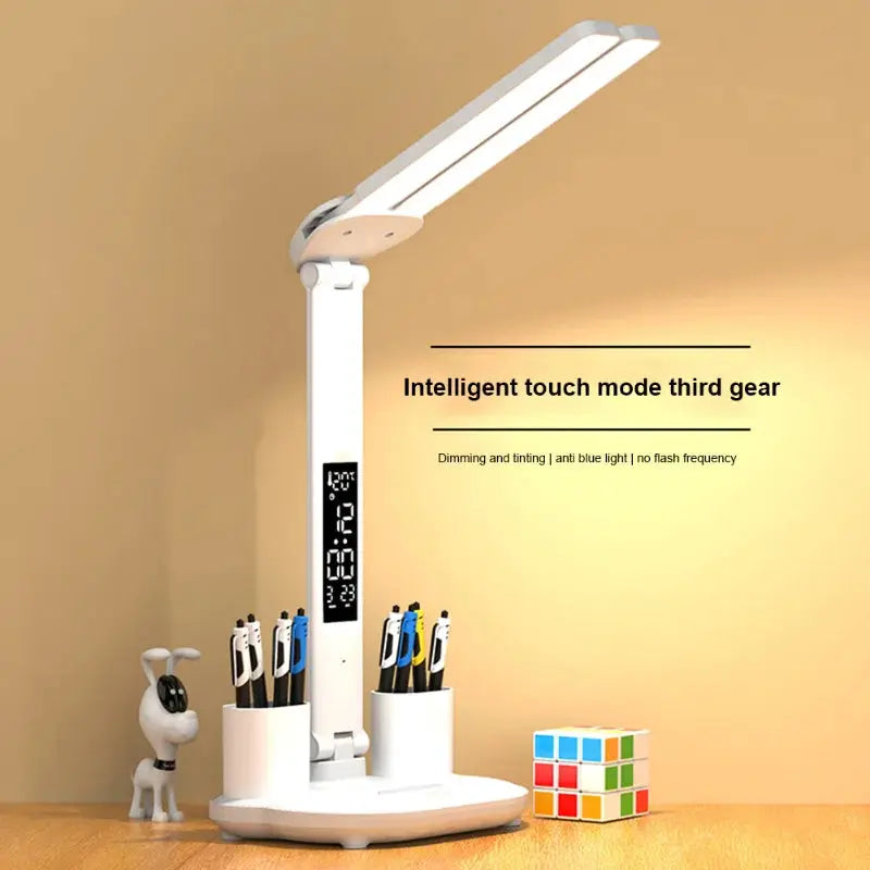 White LED clock table lamp with 2 adjustable heads, digital clock display, USB charging, and pen holders.