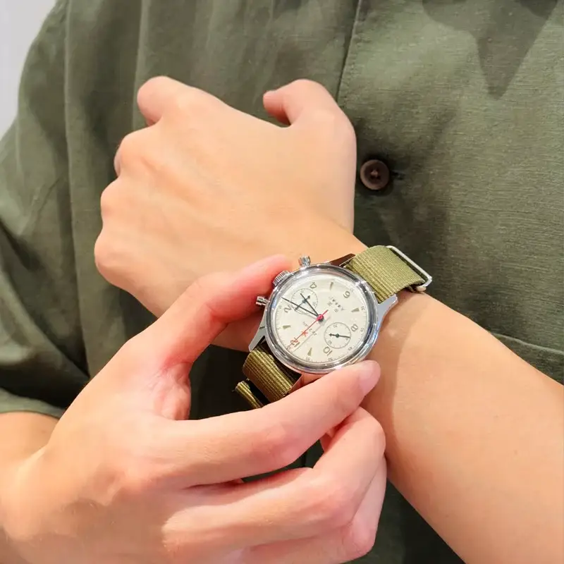 Seagull 1963 pilot chronograph wristwatch on olive canvas strap, white dial with subdials