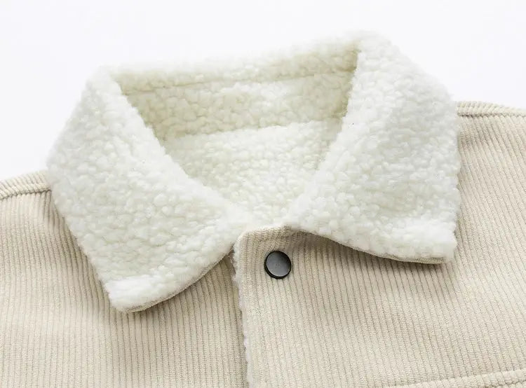 Men's beige corduroy jacket with white sherpa collar and black button.