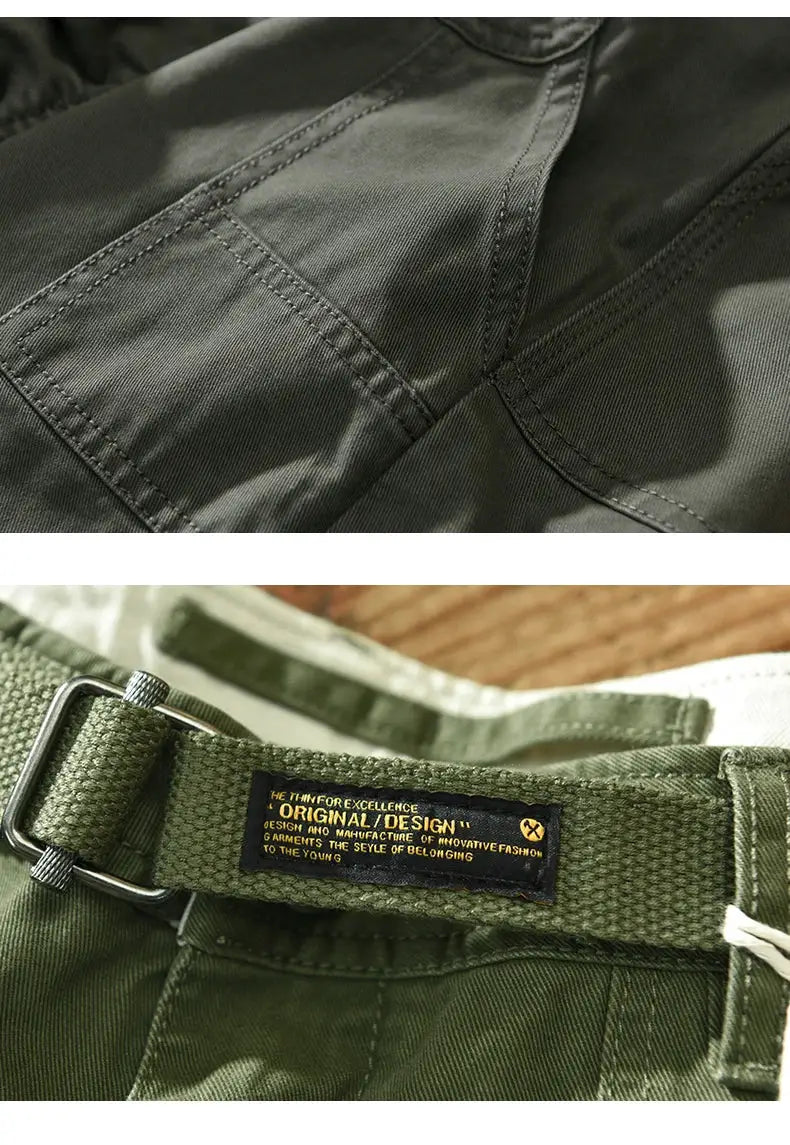 Cargo pants in olive green with belt and metal buckle; visible stitching and utility pockets.