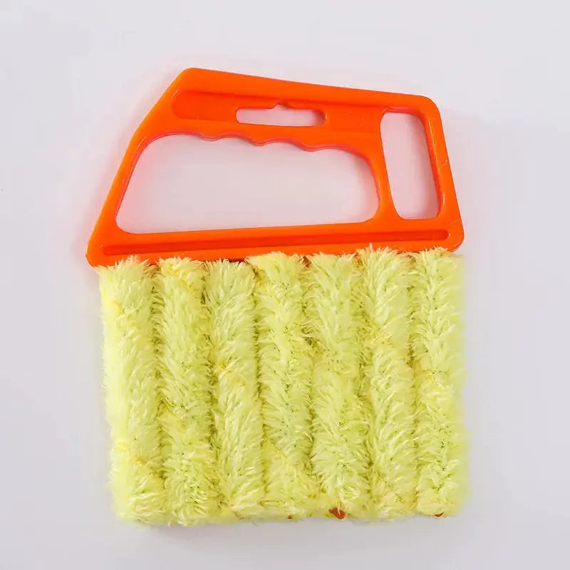 Blinds cleaning brush with orange plastic handle and yellow microfiber bristles.