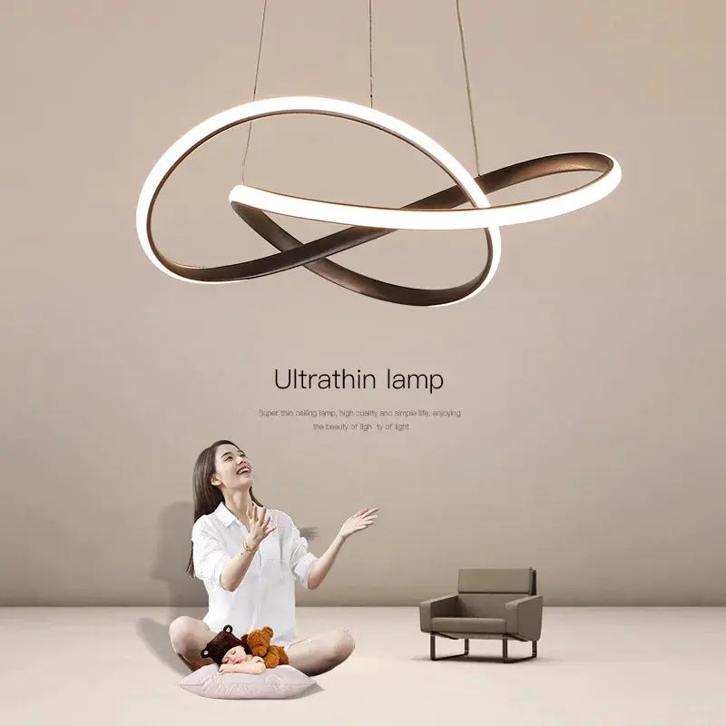 Dining room pendant lamp with intertwined circular loops in bronze and white LED light