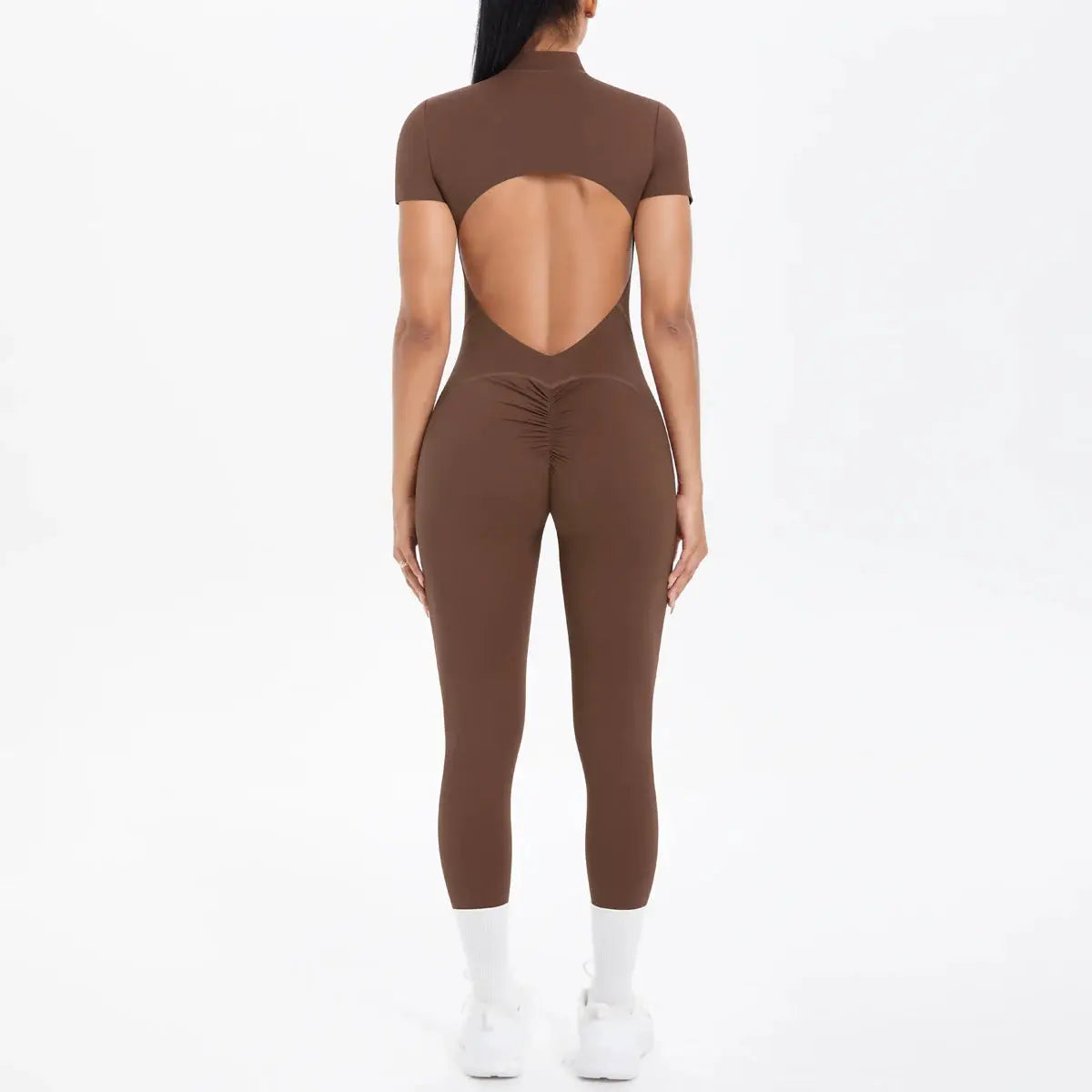Women's brown short-sleeve backless jumpsuit; one-piece fitness bodysuit with circular back cutout.