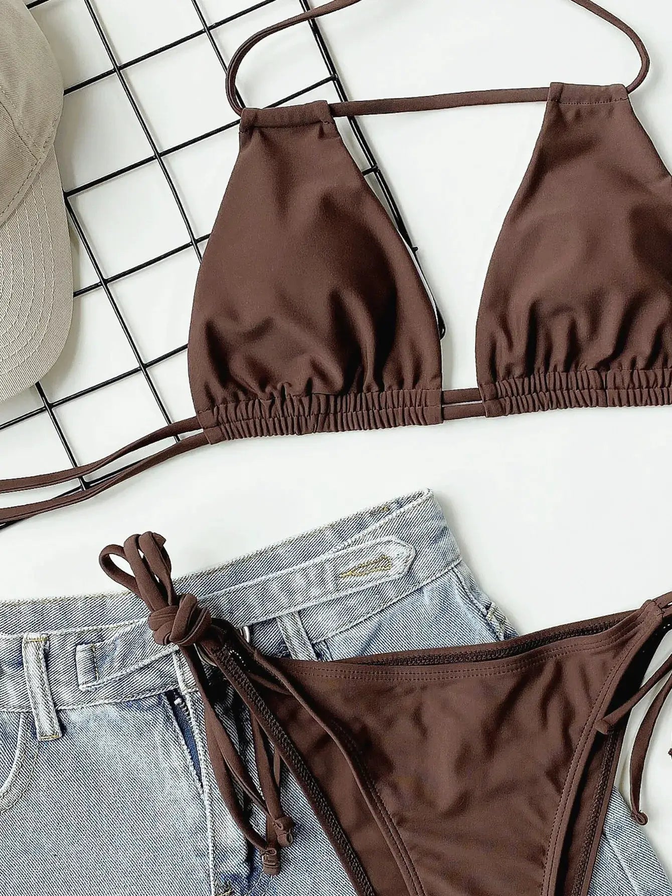 Brown two-piece bandage bikini with halter top and tie-side bottoms