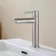 Stainless steel deck-mounted basin faucet with tall cylindrical body and side lever